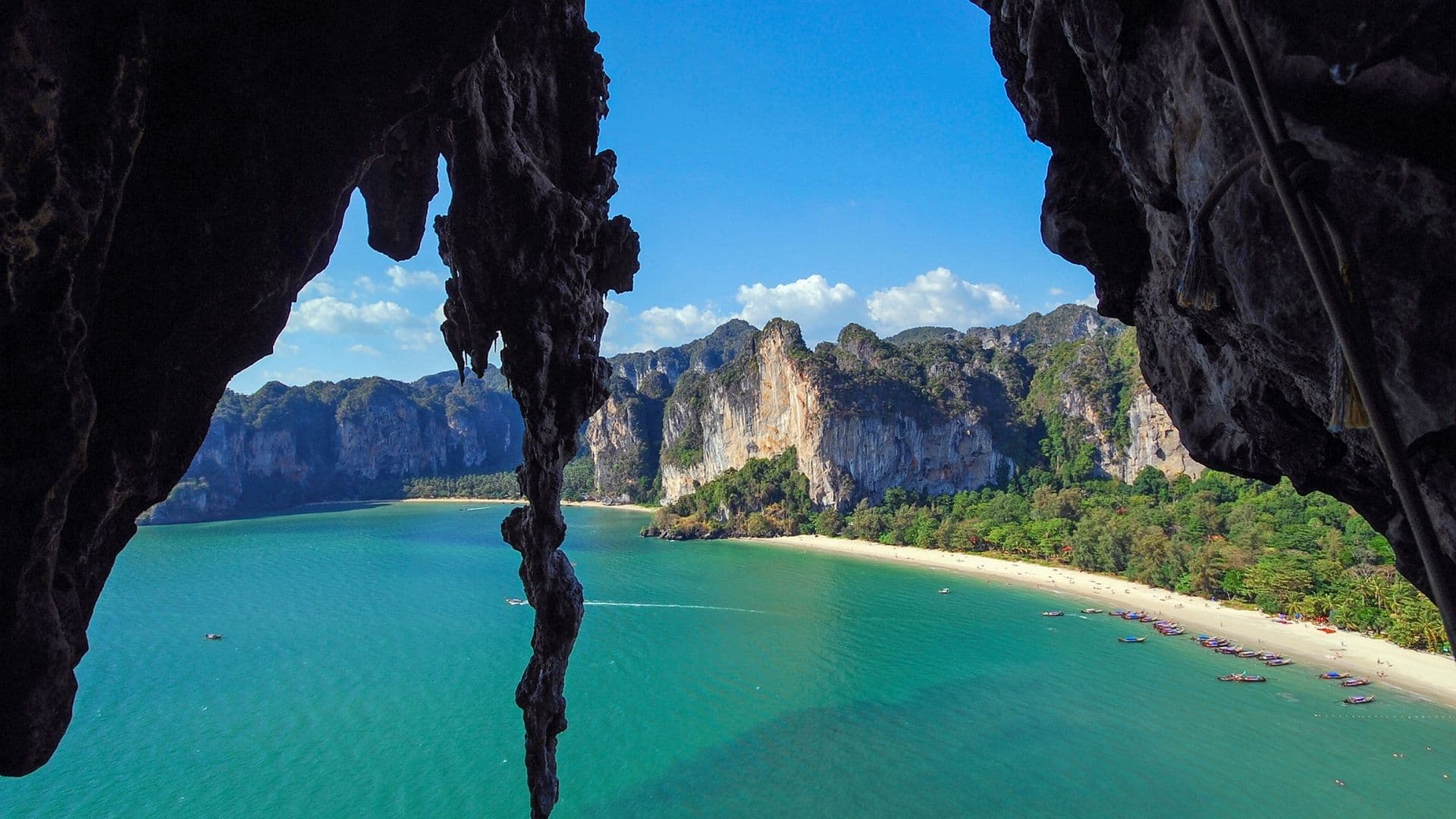 Tourist jumping from longtail boat in Maya Bay Koh Phi Phi