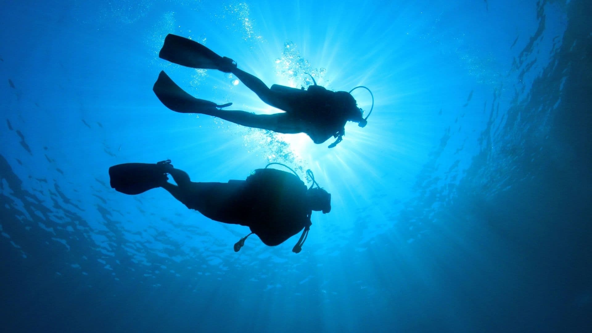 Diver in deep blue water, Thailand